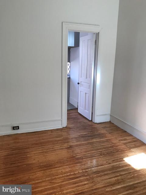 423 South 15th Street, Unit 2 Philadelphia, PA 19146 - Photo 6 of 6 a view of an empty room with wooden floor