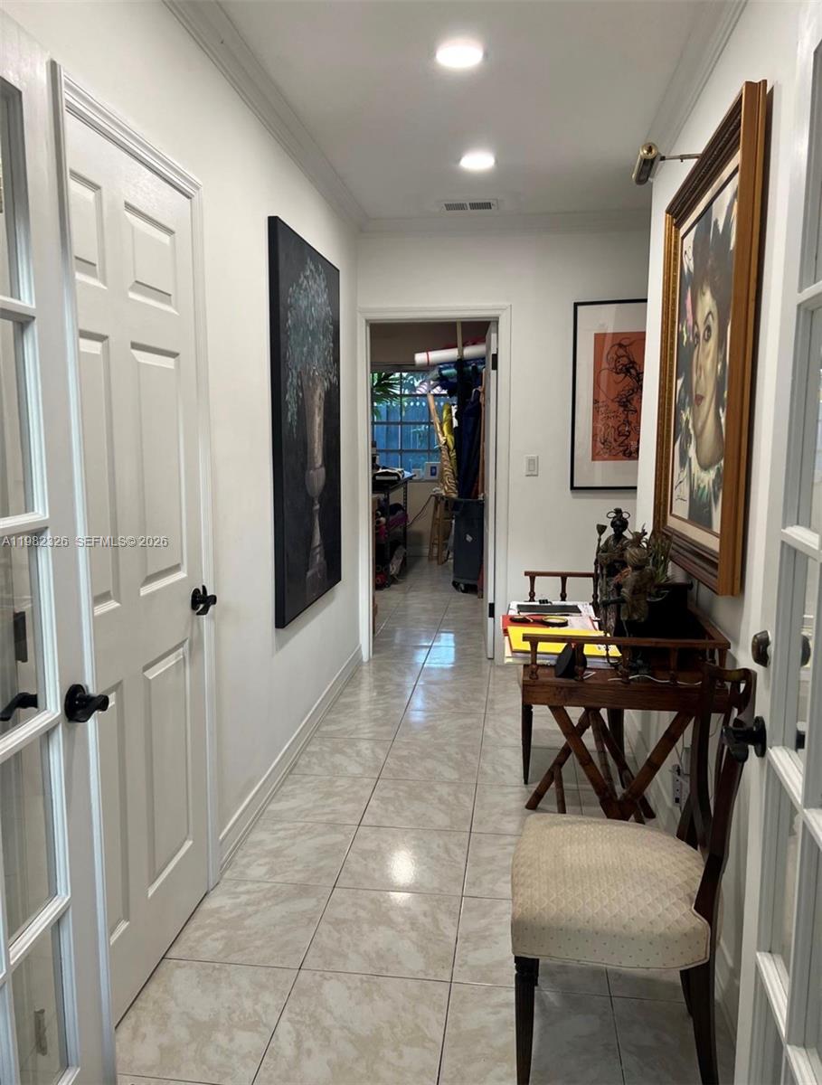 2190 Southwest 22nd Terrace Miami, FL 33145 - Photo 11 of 37 a view of a workspace with furniture and a window