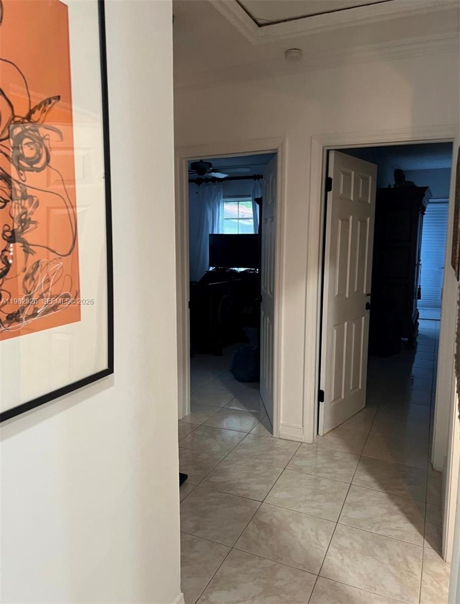 2190 Southwest 22nd Terrace Miami, FL 33145 - Photo 12 of 37 a view of a hallway with wooden shelves