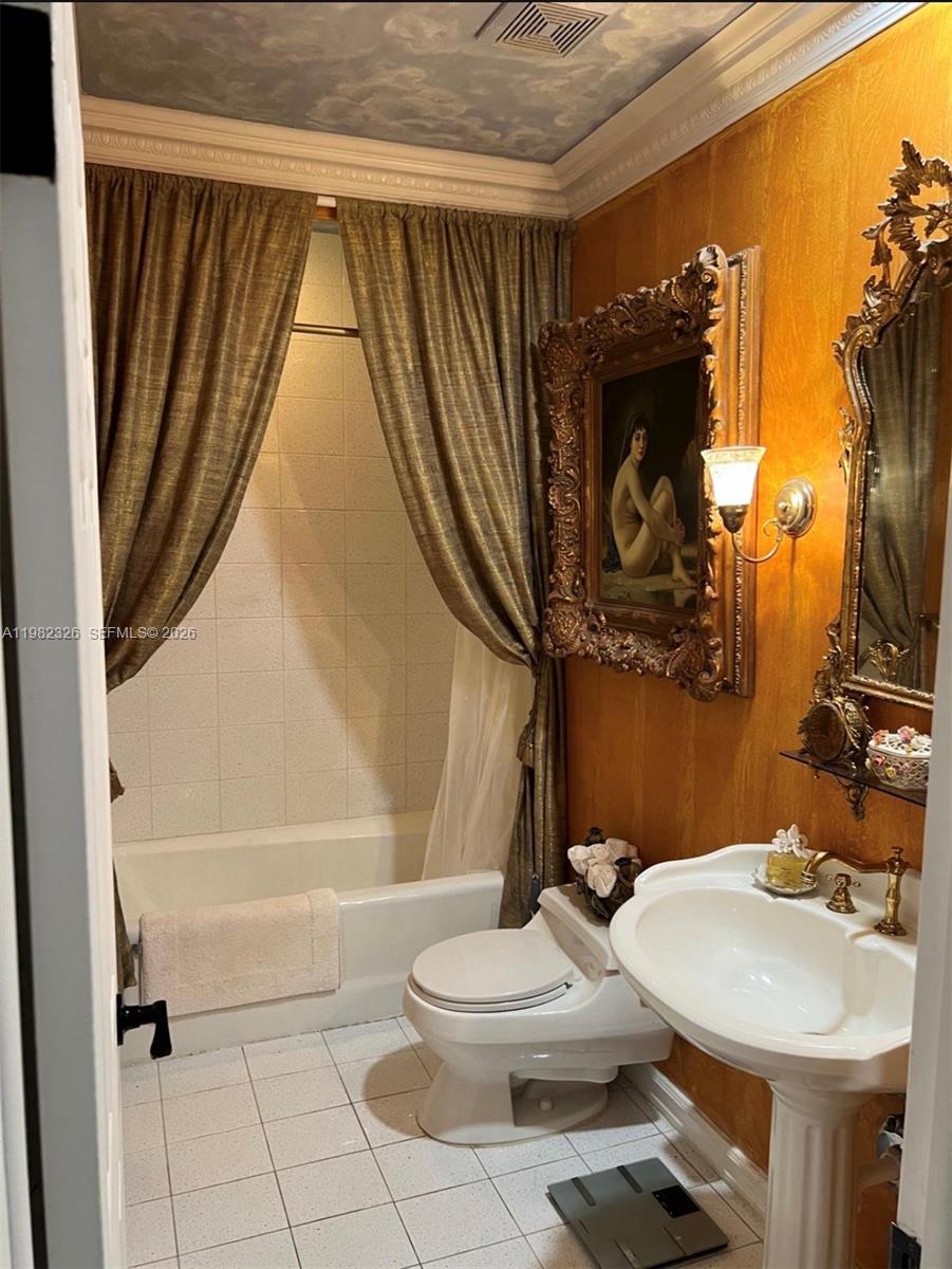 2190 Southwest 22nd Terrace Miami, FL 33145 - Photo 13 of 37 a bathroom with a sink a toilet and a mirror