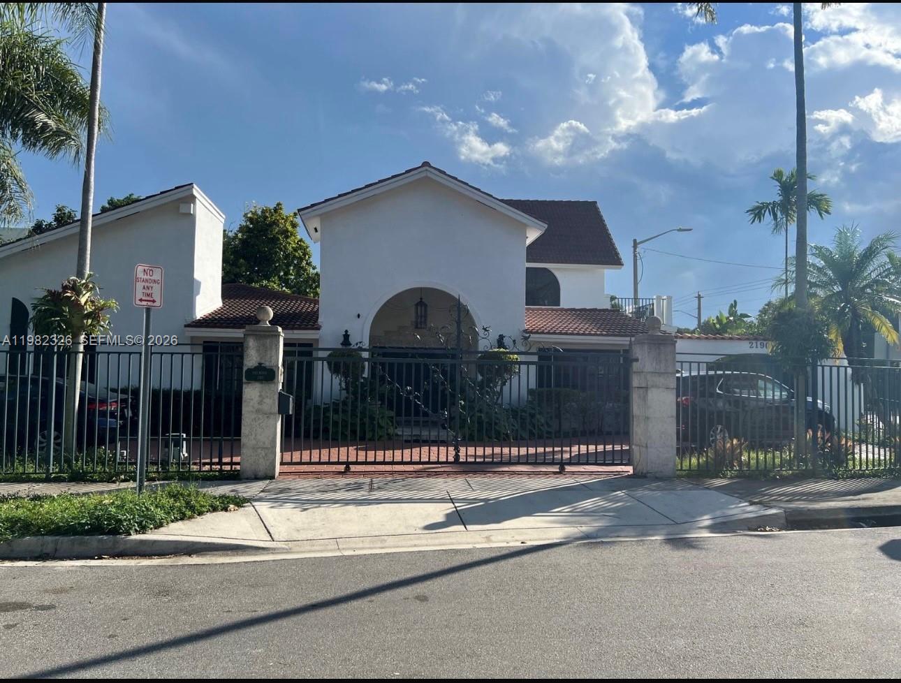 2190 Southwest 22nd Terrace Miami, FL 33145 - Photo 2 of 37 a front view of house with yard
