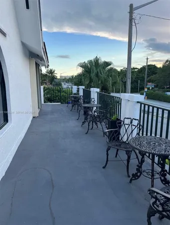 a kitchen with granite countertop a stove and cabinets