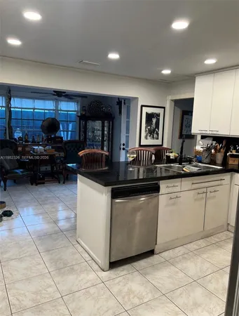 a room with a chair and a large window