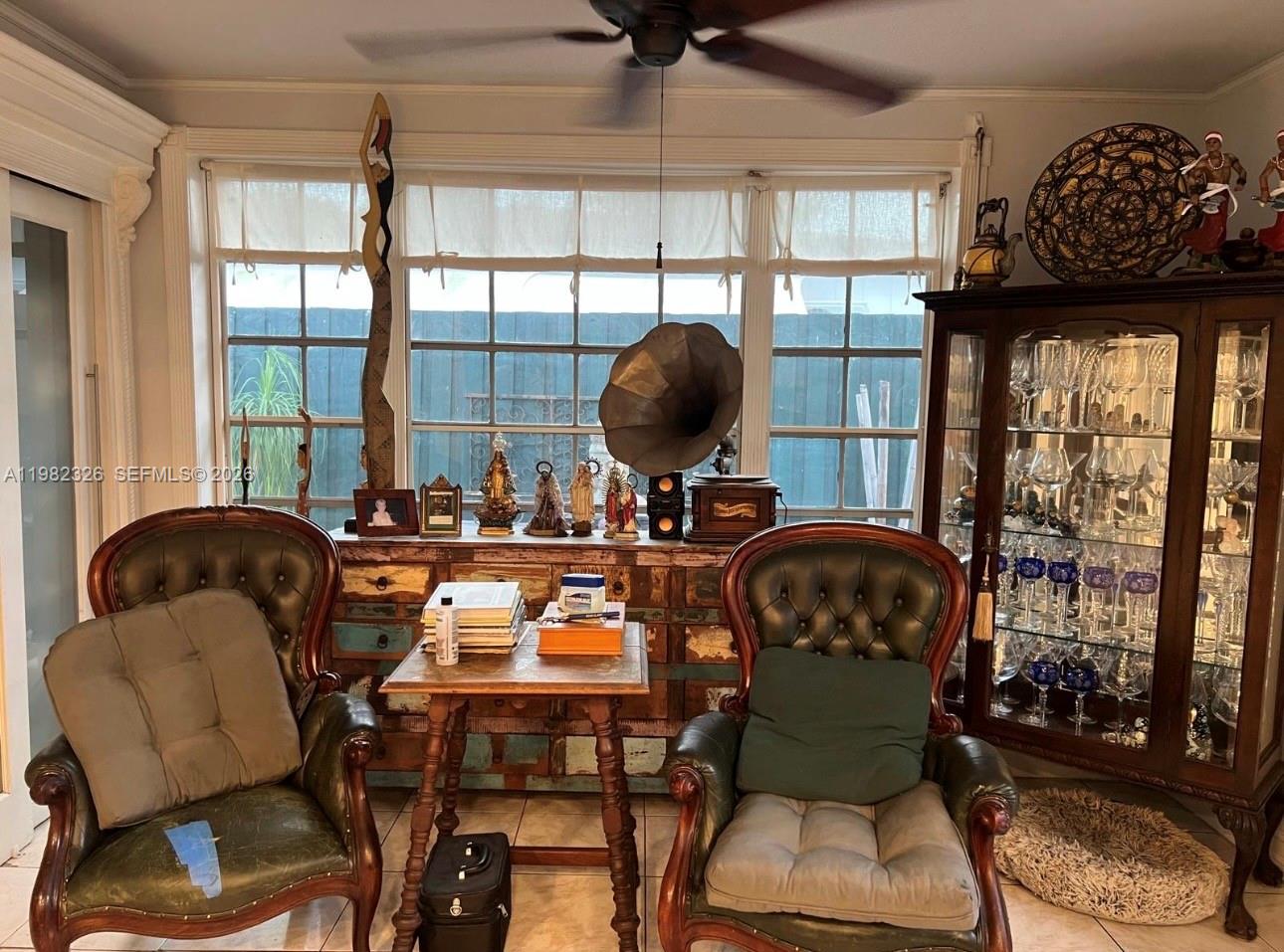 2190 Southwest 22nd Terrace Miami, FL 33145 - Photo 25 of 37 a room with a chair and a large window