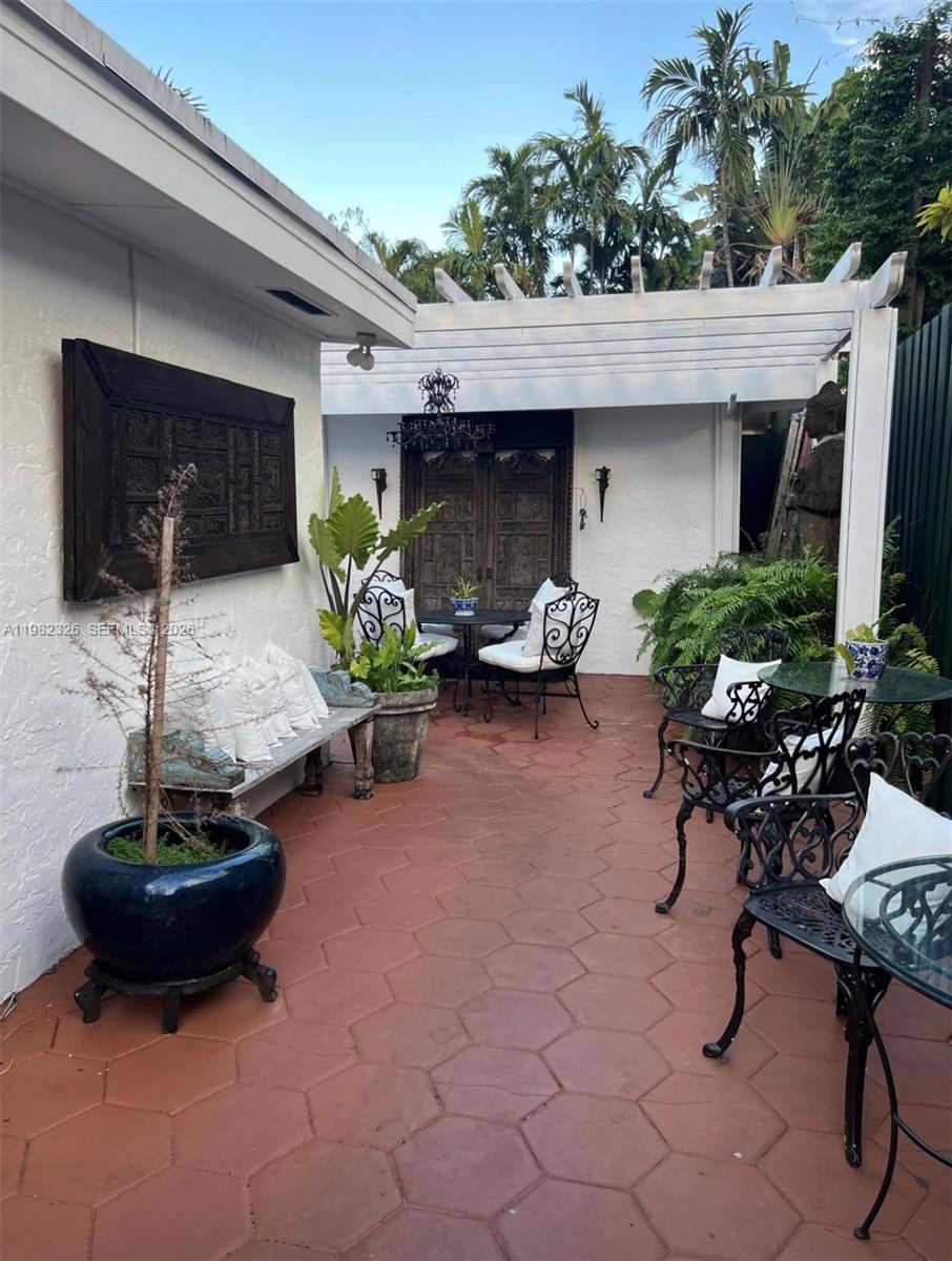 2190 Southwest 22nd Terrace Miami, FL 33145 - Photo 29 of 37 a living room with furniture a flat screen tv and potted plant