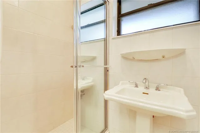 a spacious bedroom with a bed and furniture