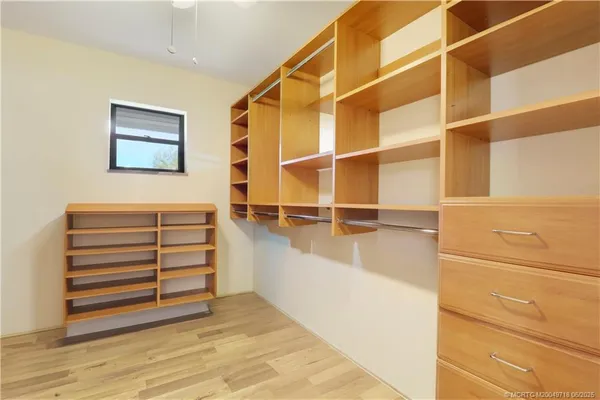 a view of a room with stairs and a wooden floor