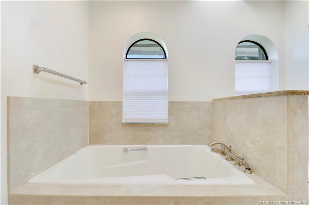 5701 Southeast Winged Foot Drive Stuart, FL 34997 - Photo 26 of 47 a bathroom with a bathtub