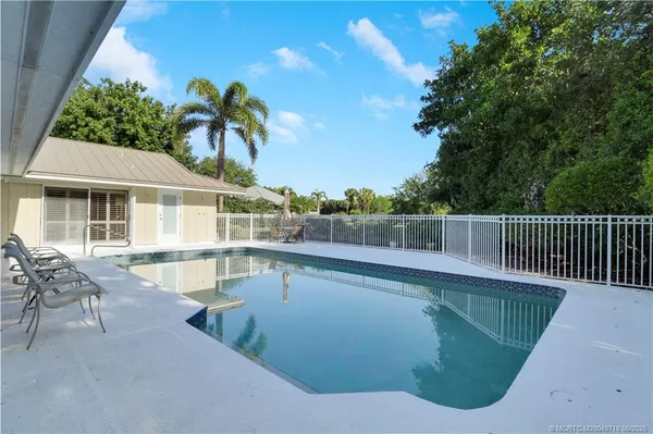 a view of a house with a swimming pool