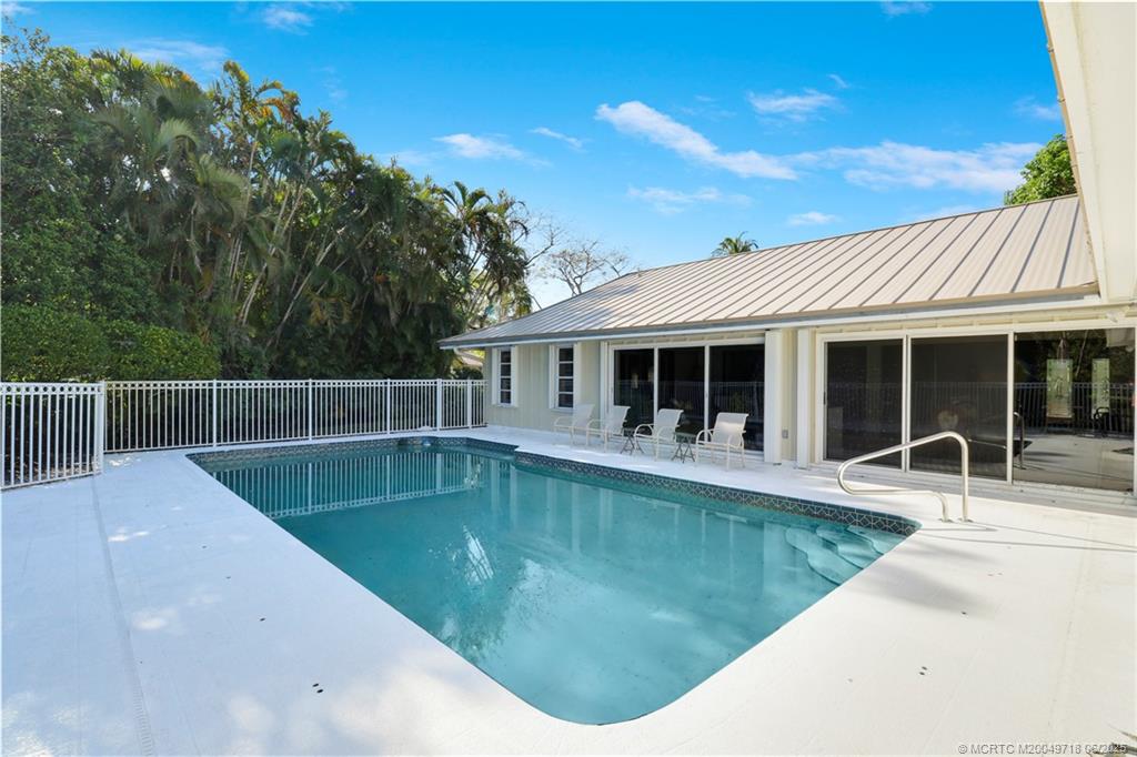 5701 Southeast Winged Foot Drive Stuart, FL 34997 - Photo 32 of 47 a view of a house with swimming pool