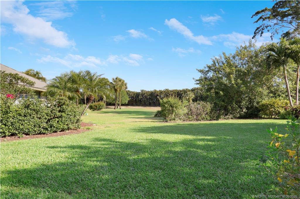 5701 Southeast Winged Foot Drive Stuart, FL 34997 - Photo 36 of 47 a view of field with trees in the background