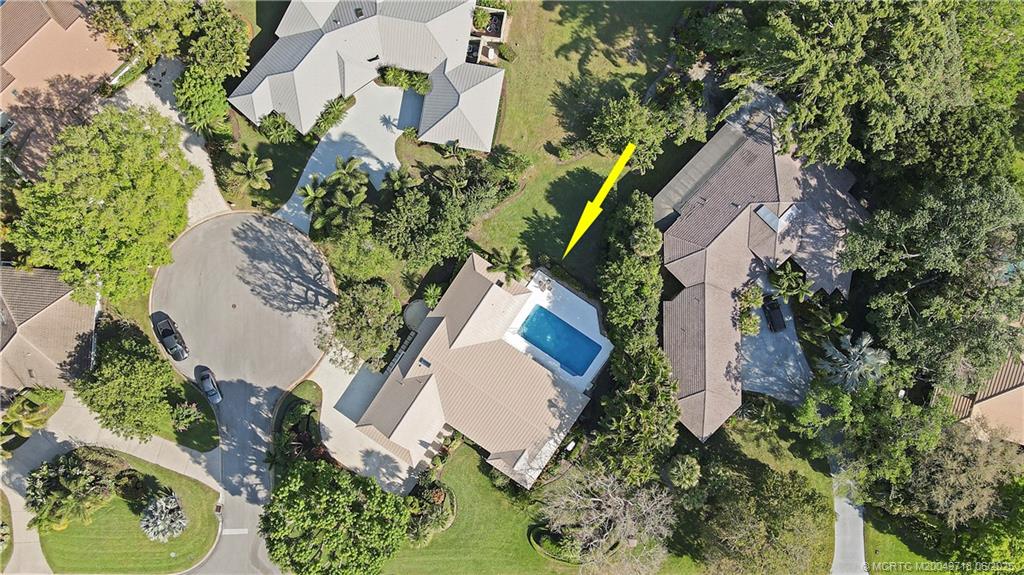 5701 Southeast Winged Foot Drive Stuart, FL 34997 - Photo 40 of 47 an aerial view of a house with a yard