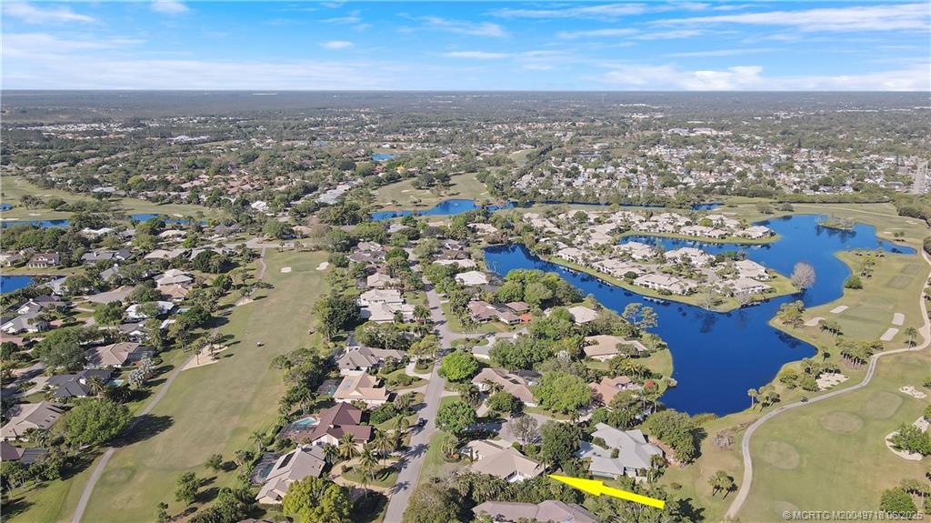 5701 Southeast Winged Foot Drive Stuart, FL 34997 - Photo 41 of 47 an aerial view of multiple house