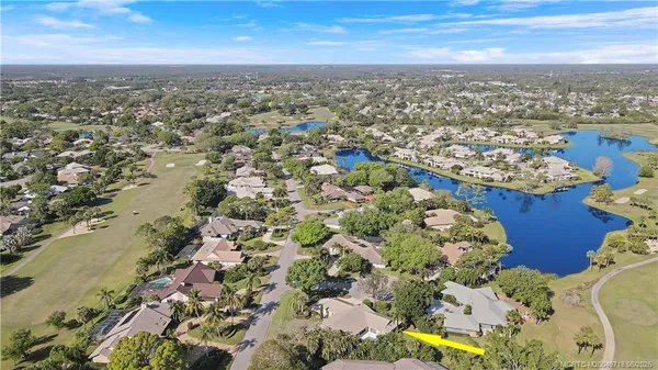 an aerial view of residential building with parking space