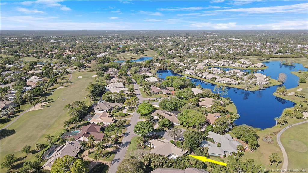 5701 Southeast Winged Foot Drive Stuart, FL 34997 - Photo 45 of 47 an aerial view of residential building with parking space