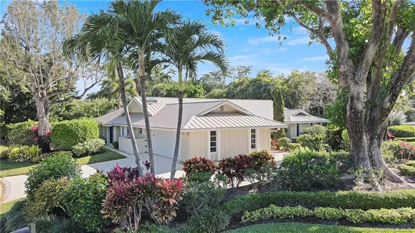 front view of a house with a garden