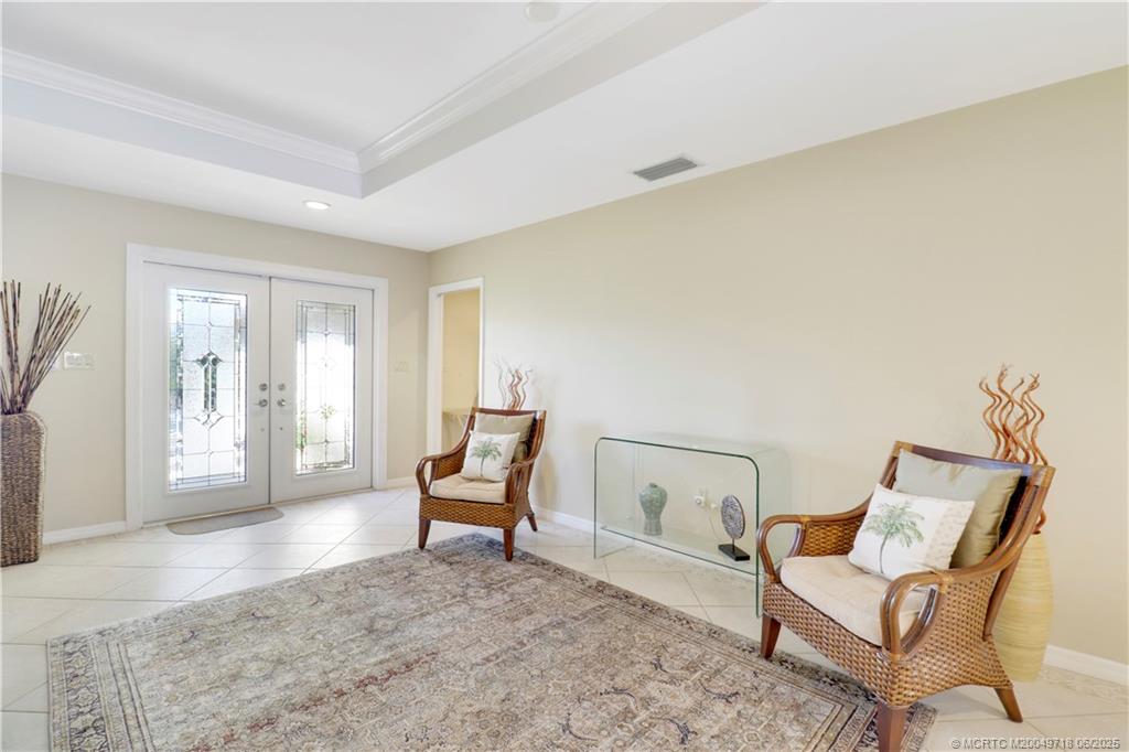 5701 Southeast Winged Foot Drive Stuart, FL 34997 - Photo 5 of 47 a living room with furniture and a window