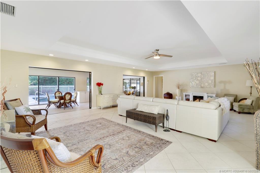 5701 Southeast Winged Foot Drive Stuart, FL 34997 - Photo 6 of 47 a living room with furniture and a couch
