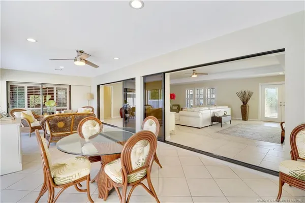 a dining room with furniture and window