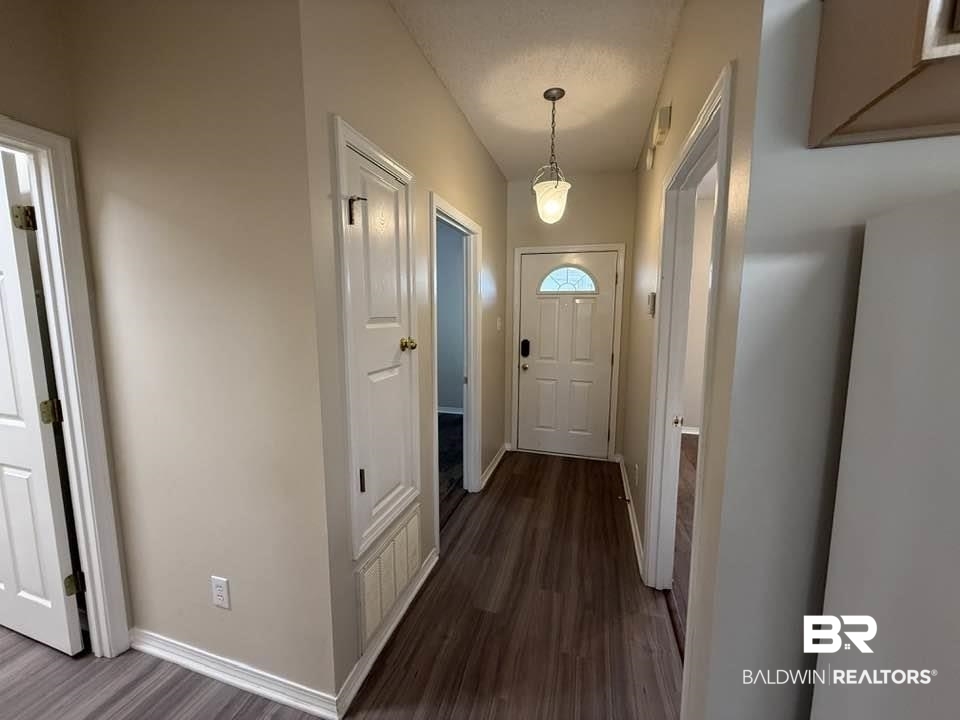 2651 South Juniper Street, Unit 401 Foley, AL 36535 - Photo 9 of 27 Entryway with dark wood-style floors and baseboards