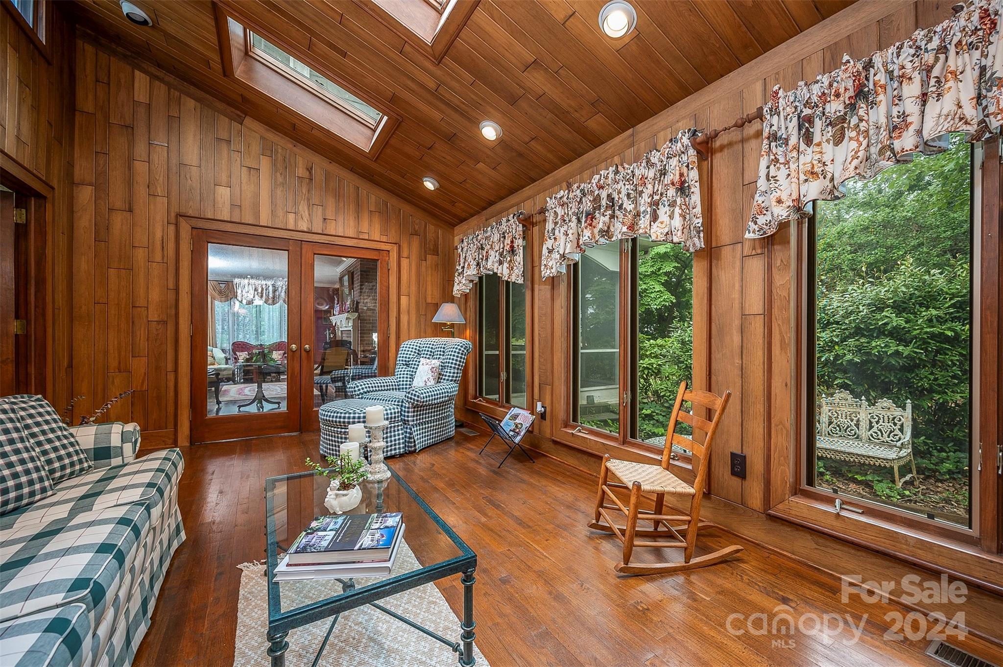 267 South Ridgecrest Avenue Rutherfordton, NC 28139 - Photo 21 of 48 a living room with patio furniture and a floor to ceiling window
