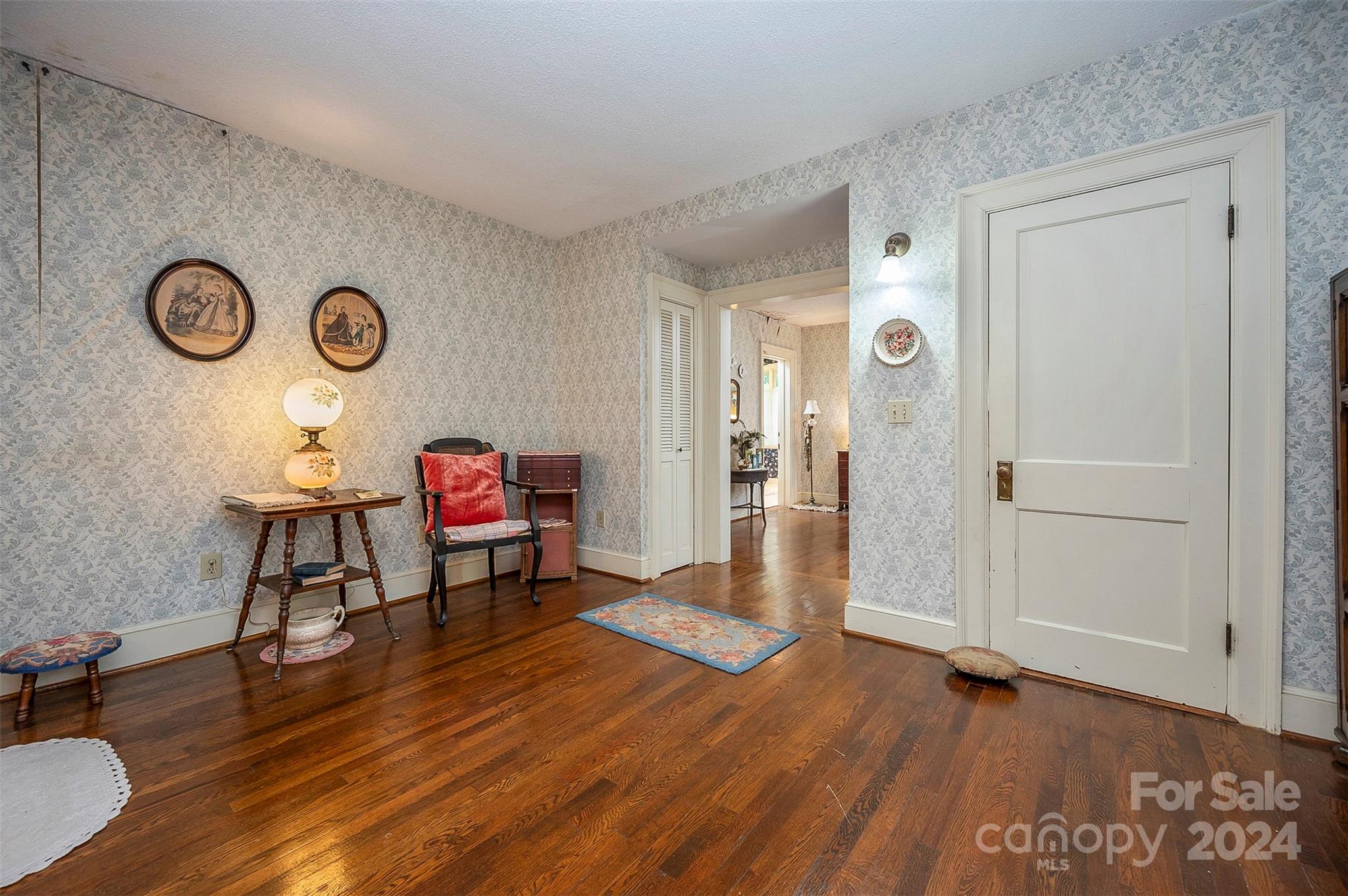 267 South Ridgecrest Avenue Rutherfordton, NC 28139 - Photo 28 of 48 a living room with furniture and a wooden floor