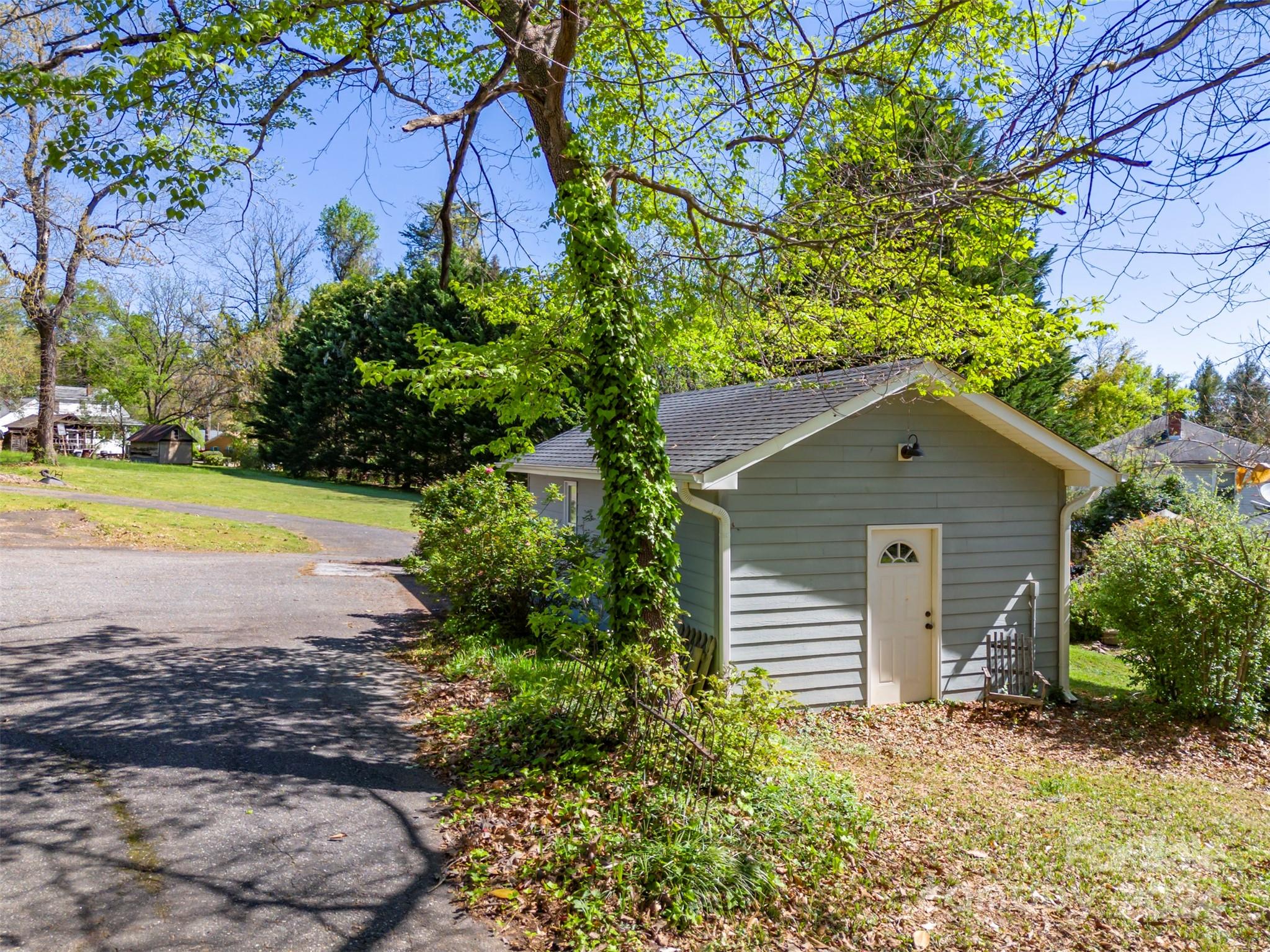 267 South Ridgecrest Avenue Rutherfordton, NC 28139 - Photo 42 of 48 a view of a house with a yard and plants