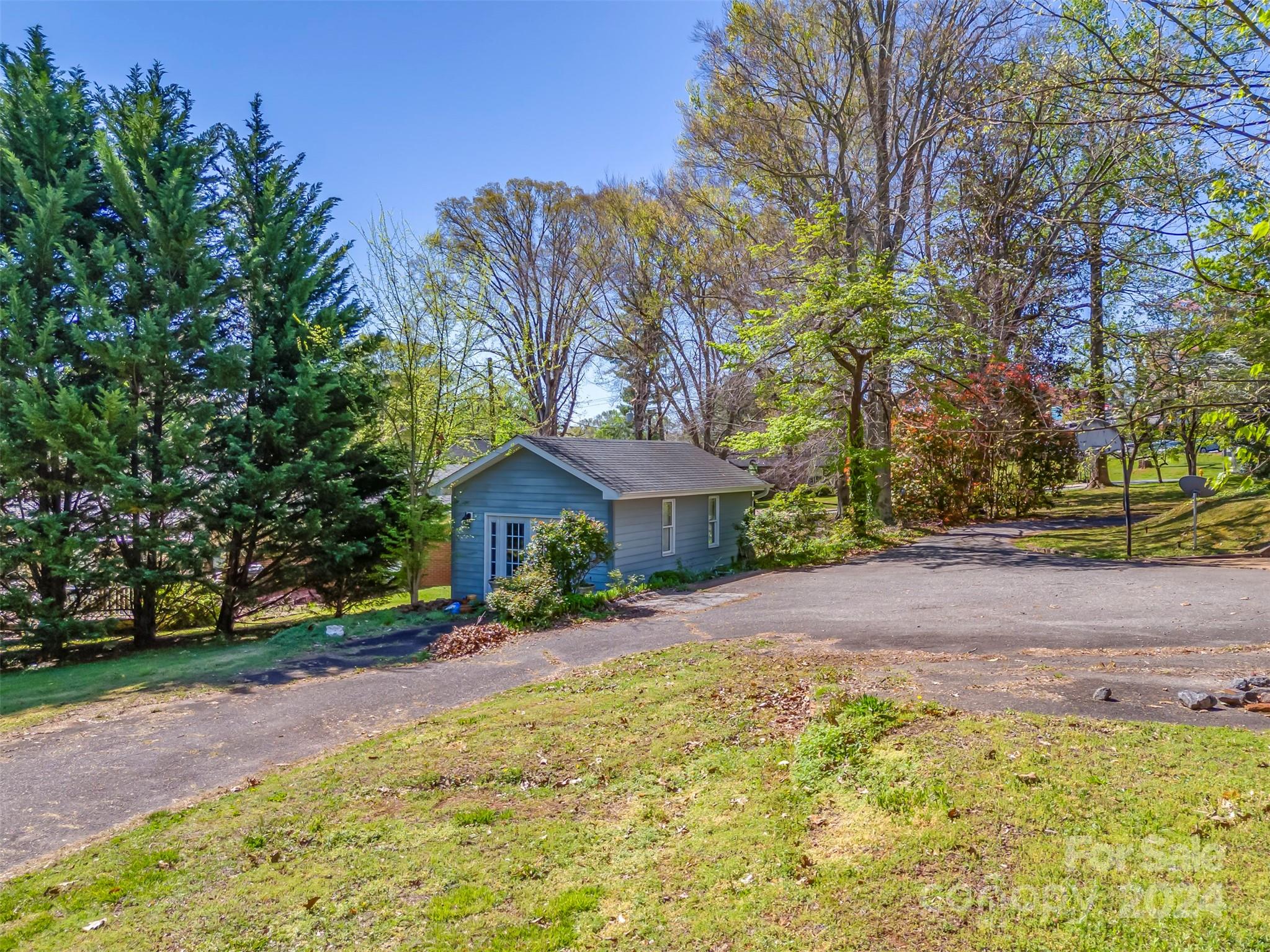 267 South Ridgecrest Avenue Rutherfordton, NC 28139 - Photo 44 of 48 a view of a house with a yard and large trees