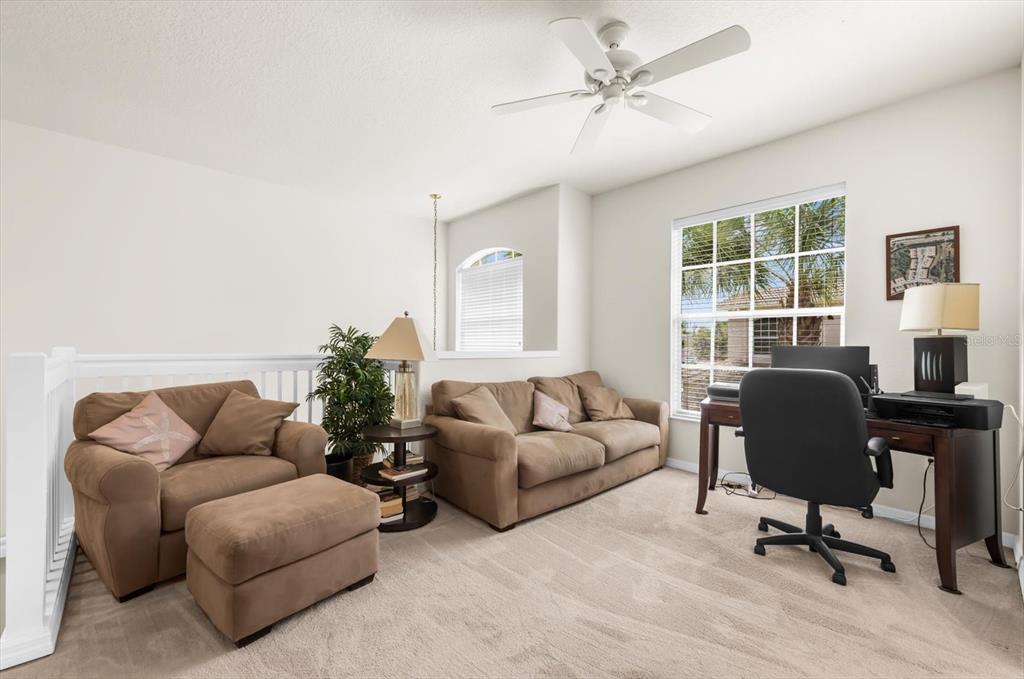 4500 Streamside Court, Unit 1408 Sarasota, FL 34238 - Photo 12 of 73 a living room with furniture and a window