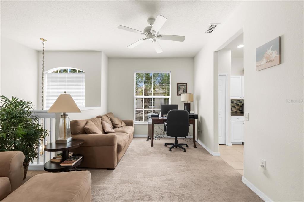 4500 Streamside Court, Unit 1408 Sarasota, FL 34238 - Photo 13 of 73 a living room with furniture and a window