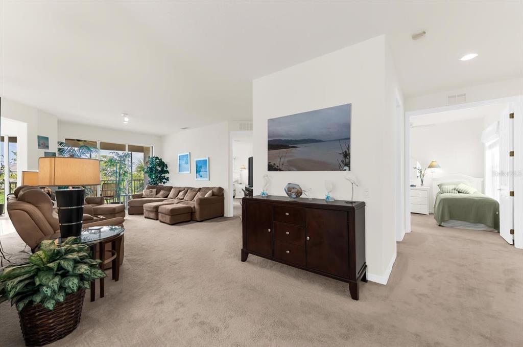 4500 Streamside Court, Unit 1408 Sarasota, FL 34238 - Photo 14 of 73 a living room with furniture and a flat screen tv