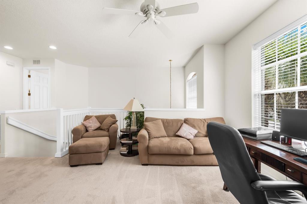 4500 Streamside Court, Unit 1408 Sarasota, FL 34238 - Photo 15 of 73 a living room with furniture and a window