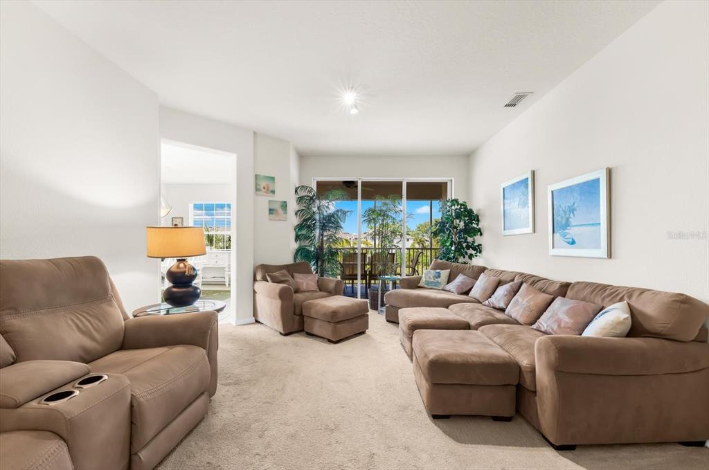 4500 Streamside Court, Unit 1408 Sarasota, FL 34238 - Photo 20 of 73 a living room with furniture and a large window