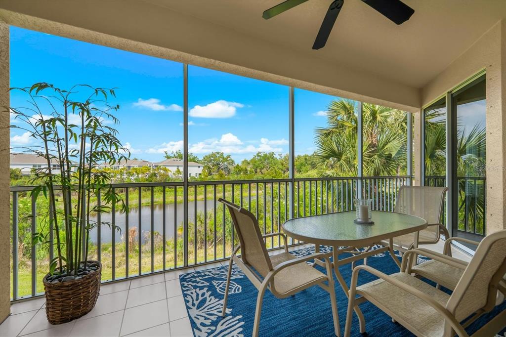 4500 Streamside Court, Unit 1408 Sarasota, FL 34238 - Photo 2 of 73 a view of a dining room with furniture window and outside view