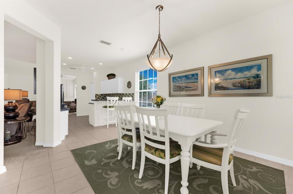 4500 Streamside Court, Unit 1408 Sarasota, FL 34238 - Photo 27 of 73 a view of a dining room with furniture