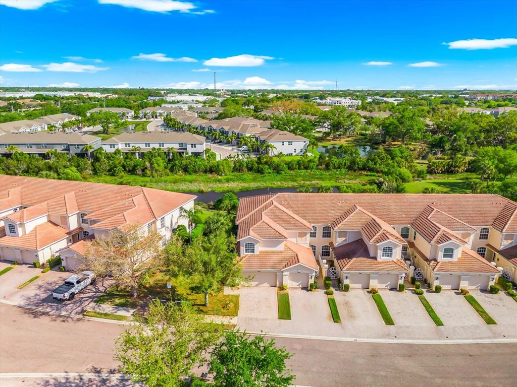 4500 Streamside Court, Unit 1408 Sarasota, FL 34238 - Photo 40 of 73 an aerial view of a house with a yard