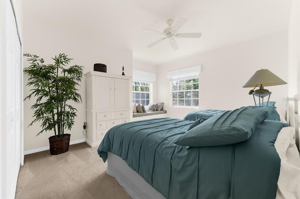 4500 Streamside Court, Unit 1408 Sarasota, FL 34238 - Photo 47 of 73 a bedroom with a bed and a potted plant