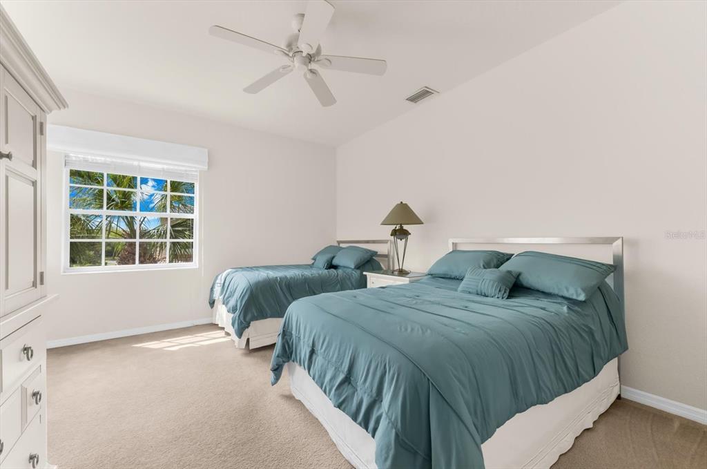 4500 Streamside Court, Unit 1408 Sarasota, FL 34238 - Photo 48 of 73 a bedroom with two beds and a window