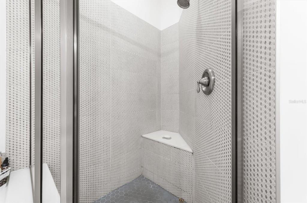 4500 Streamside Court, Unit 1408 Sarasota, FL 34238 - Photo 57 of 73 a bathroom with a shower