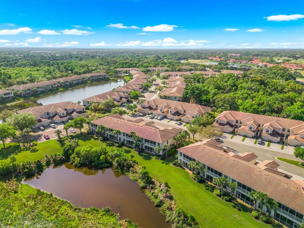 4500 Streamside Court, Unit 1408 Sarasota, FL 34238 - Photo 66 of 73 an aerial view of a house with a garden