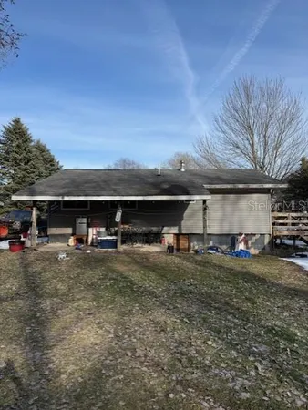 a backyard of a house with seating space
