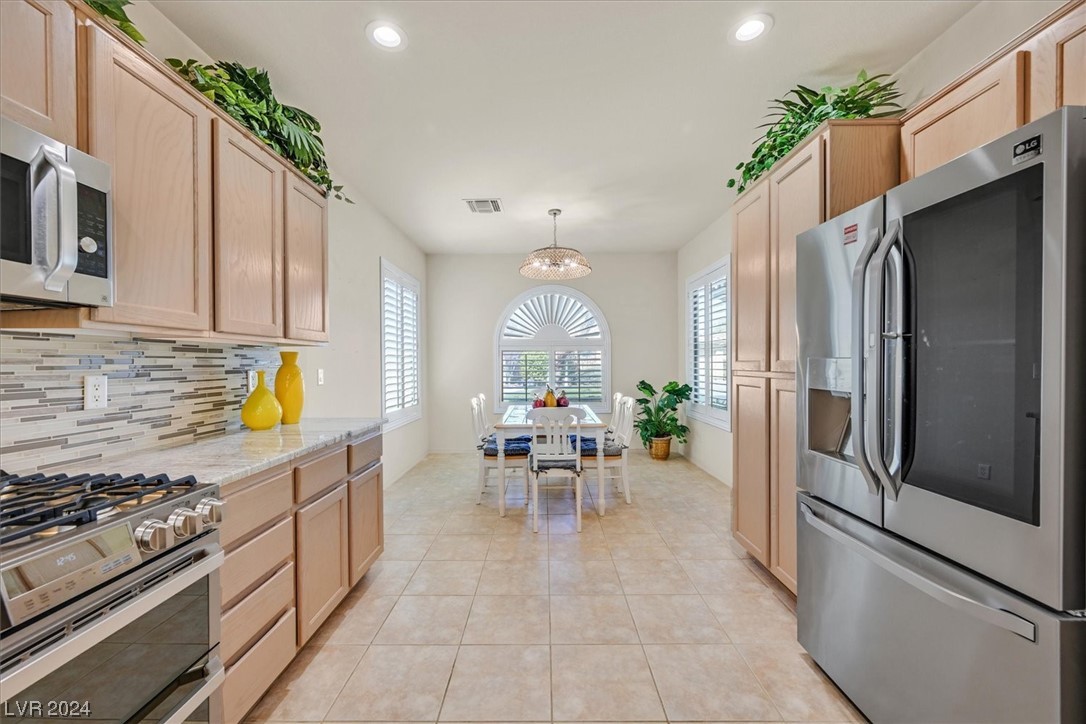 9 Chatmoss Road Henderson, NV 89052 - Photo 10 of 45 Stainless steel appliances with kitchen eating are