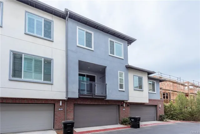 a front view of a building with a lot of windows