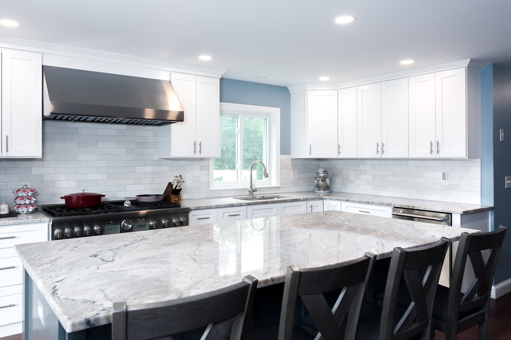 47 Glenwood Road Rutland, MA 01543 - Photo 3 of 35 a kitchen with stainless steel appliances a table chairs sink and cabinets