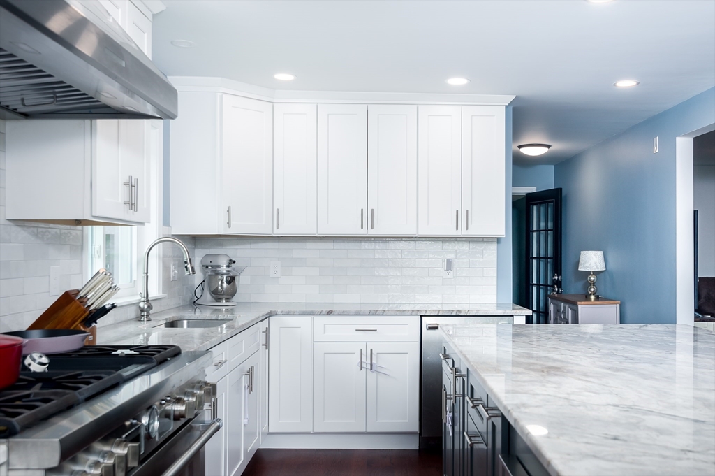 47 Glenwood Road Rutland, MA 01543 - Photo 5 of 35 a kitchen with granite countertop a sink a stove and cabinets