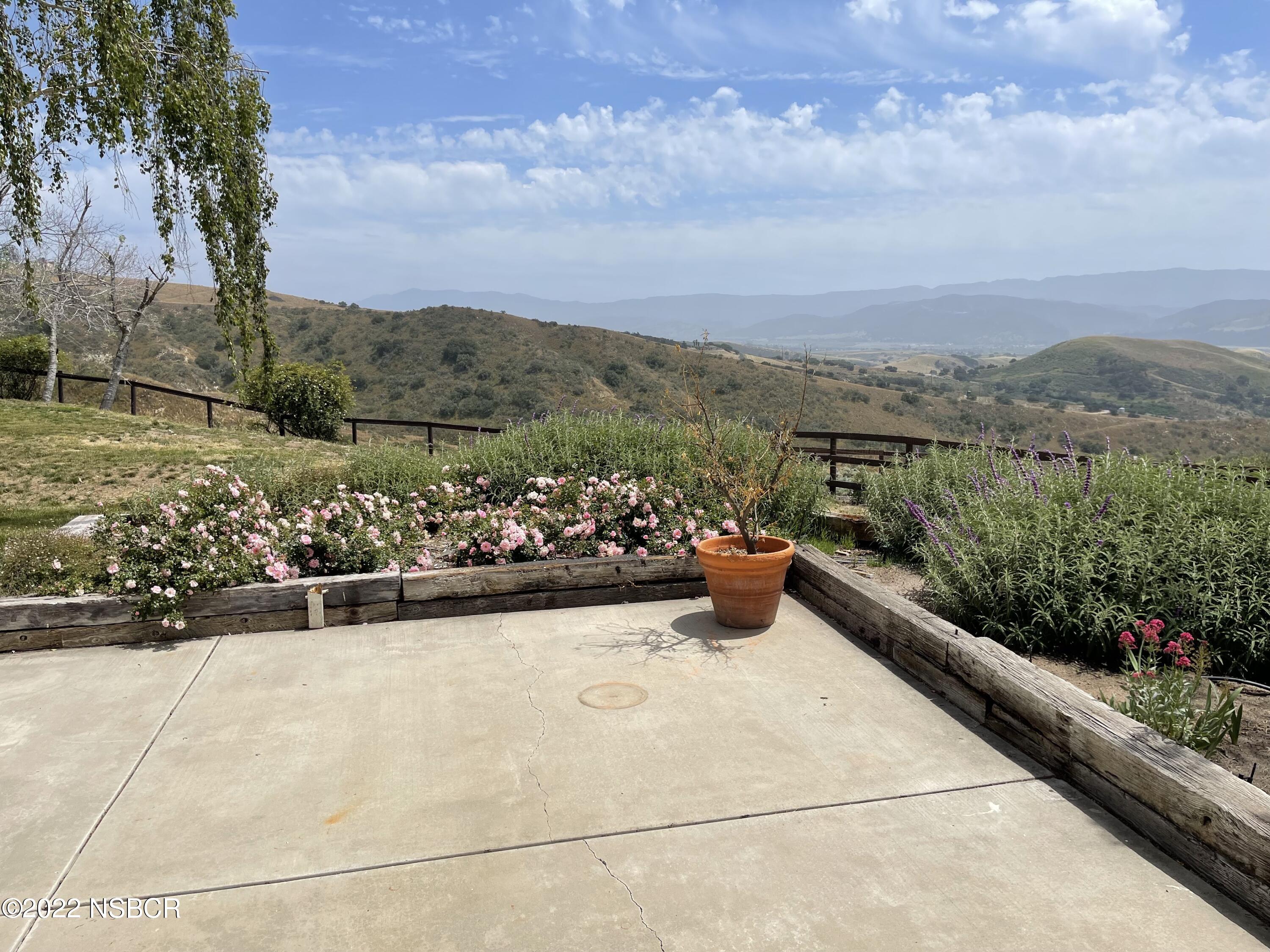 1833 Cougar Ridge Road Buellton, CA 93427 - Photo 21 of 46 a view of a terrace with a garden
