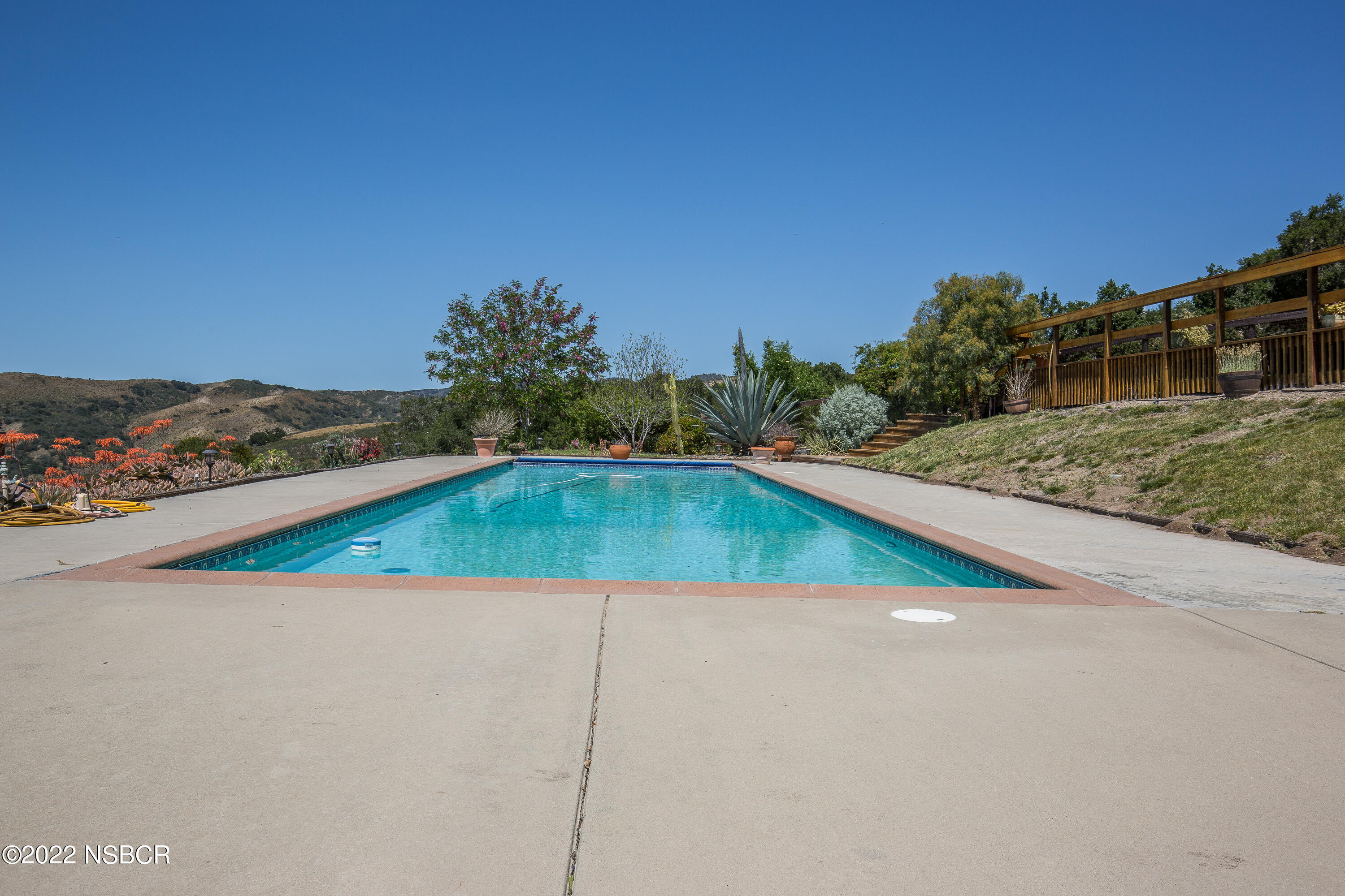 1833 Cougar Ridge Road Buellton, CA 93427 - Photo 28 of 46 a view of a pool and trees in the background