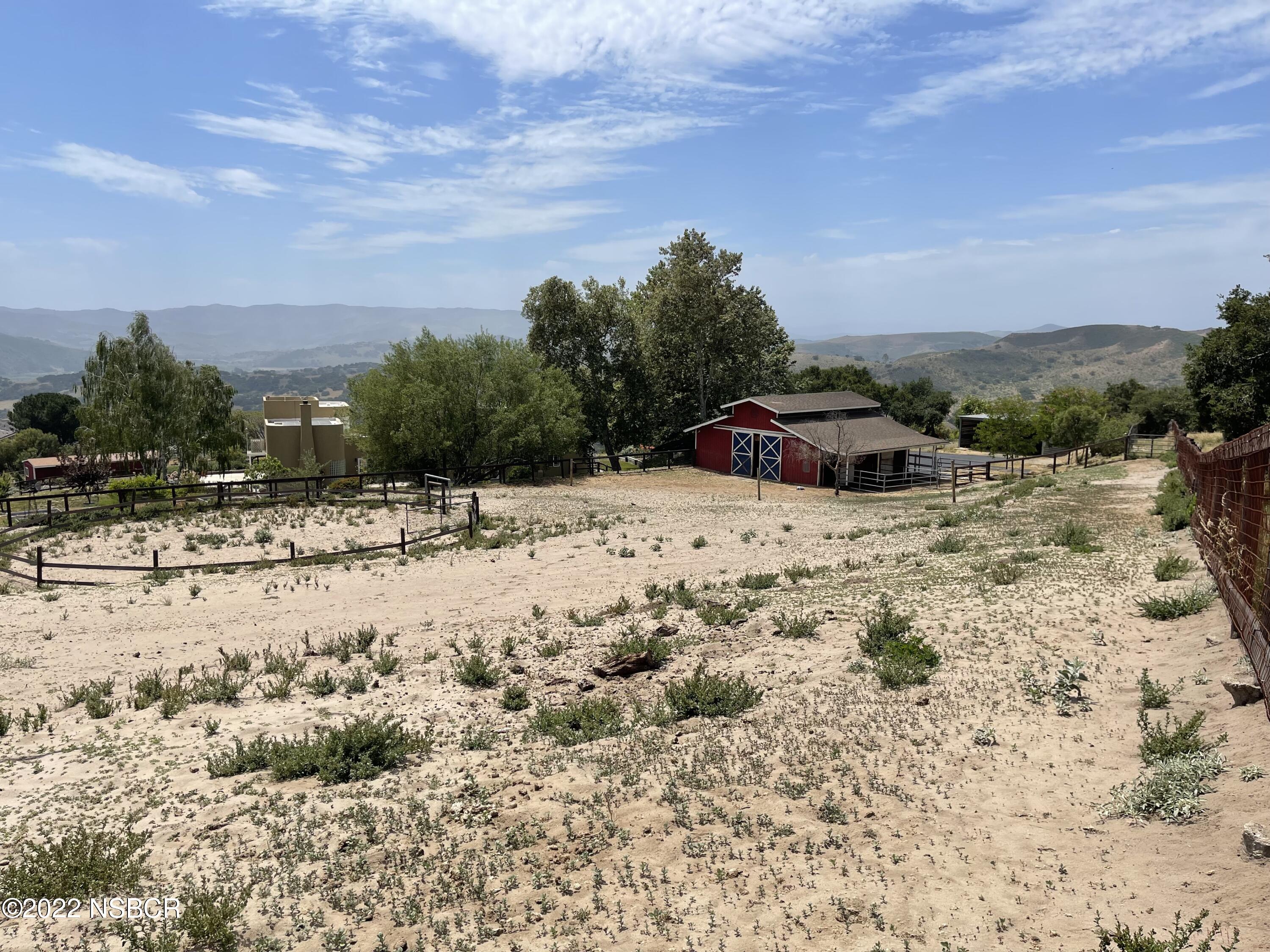 1833 Cougar Ridge Road Buellton, CA 93427 - Photo 6 of 46 a view of a dry yard with a large tree