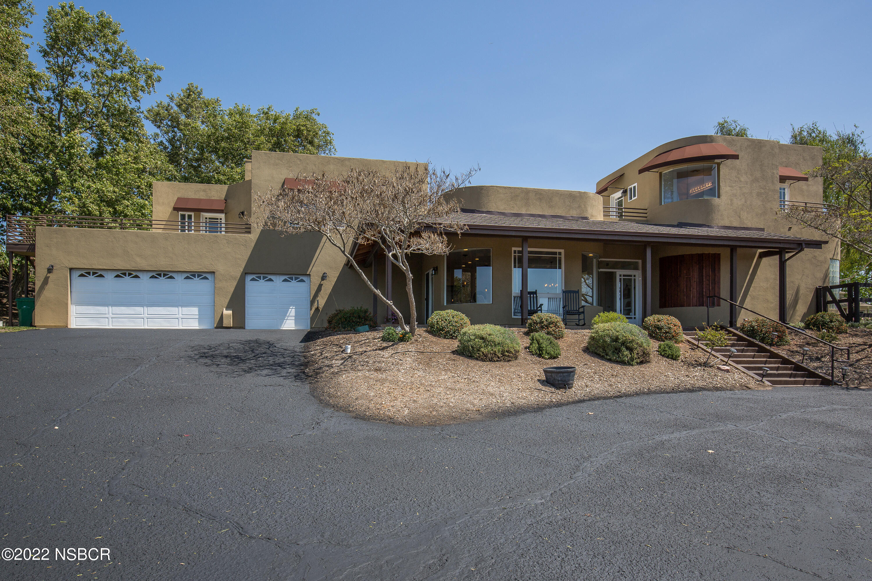 1833 Cougar Ridge Road Buellton, CA 93427 - Photo 8 of 46 a front view of a house with garden