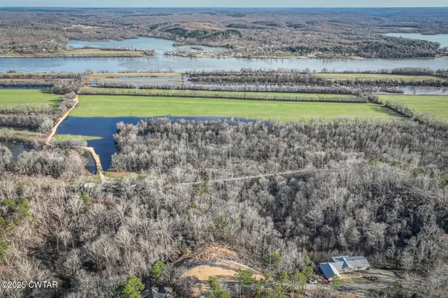a view of a swimming pool and a yard